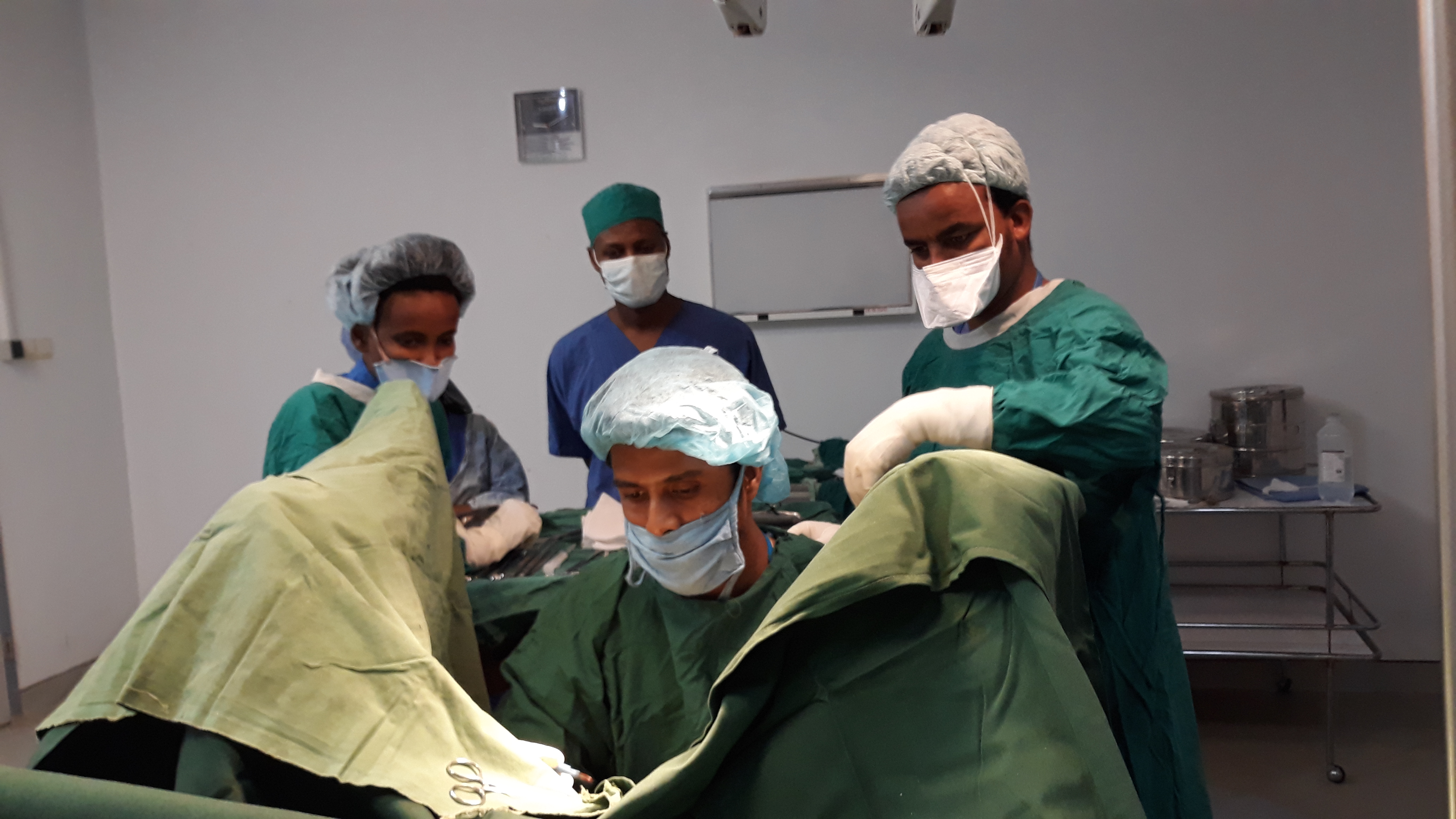 Sailes performing C-section supported by his Eritrean colleagues
